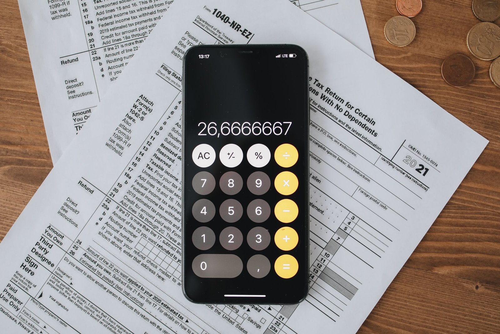 Financial aid forms and calculator, symbolizing FAFSA processing at a college financial aid office
