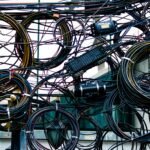 A tangle of interconnected cables, symbolizing AppExchange app sprawl and accumulated technical debt